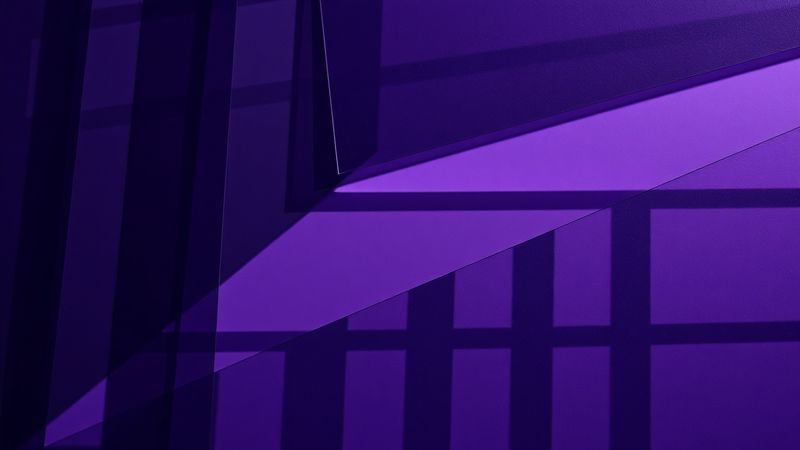 Overhead shot of layered transparent sheets of violet and black stacked at oblique angles illustration for The Case Study With No Second Act