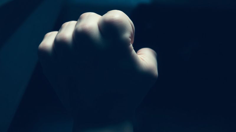 extreme close-up of a hand gripping a bannister mid-motion illustration for The Room That Sings and the Three Steps That Stop Me